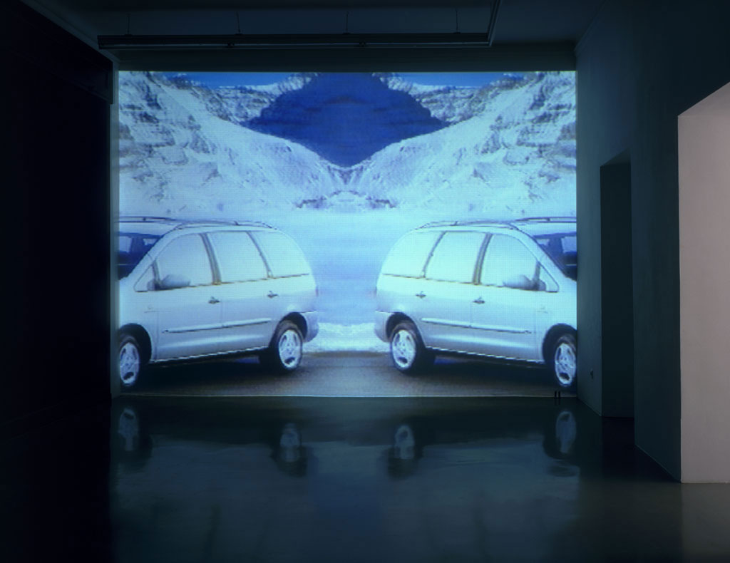 Claude Closky, ‘Mountains and Mini-Vans ’, 1997-1998, projector, dvd, dvd player, silent, wall-to-wall & floor-to-ceiling projection, unlimited duration. Exhibition view ‘Fines de Claire’, Galerie Mehdi Chouakri, Berlin. 20 June - 1 August 1998.